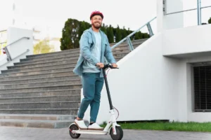 man riding electric scooter 